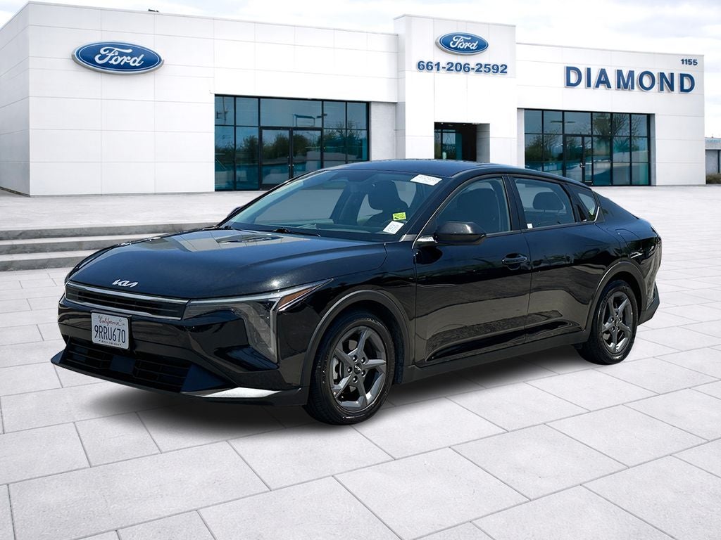 2025 Kia K4 LXS in Aurora Black Pearl — front three-quarter view