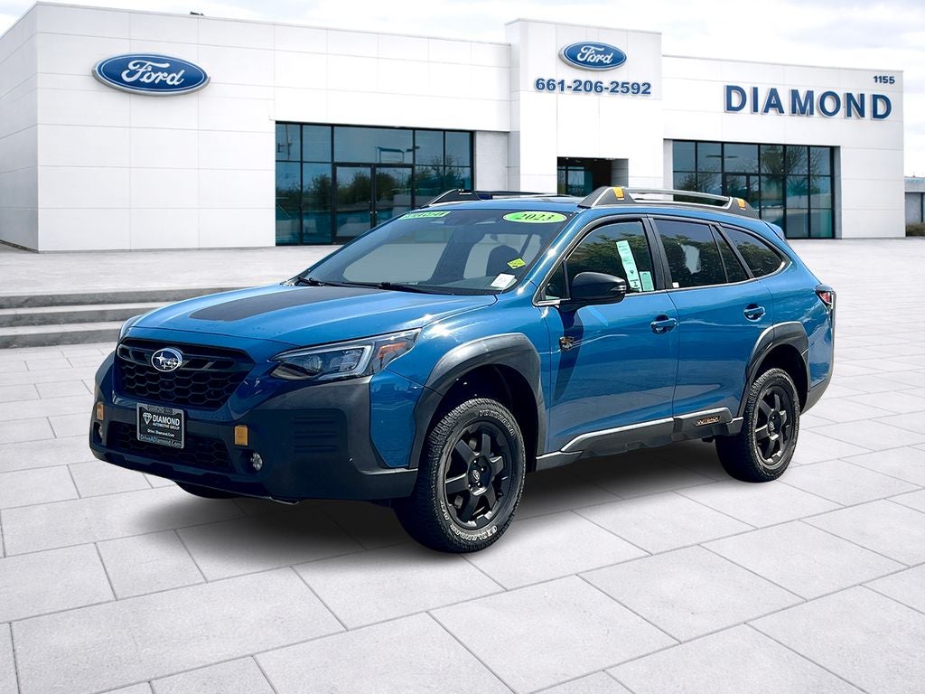 2023 Subaru Outback Wilderness in Geyser Blue — front three-quarter view