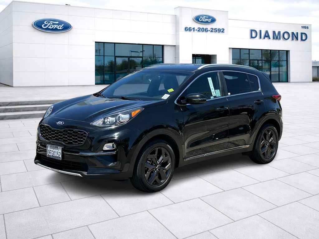 2021 Kia Sportage S in Black Cherry Pearl — front three-quarter view