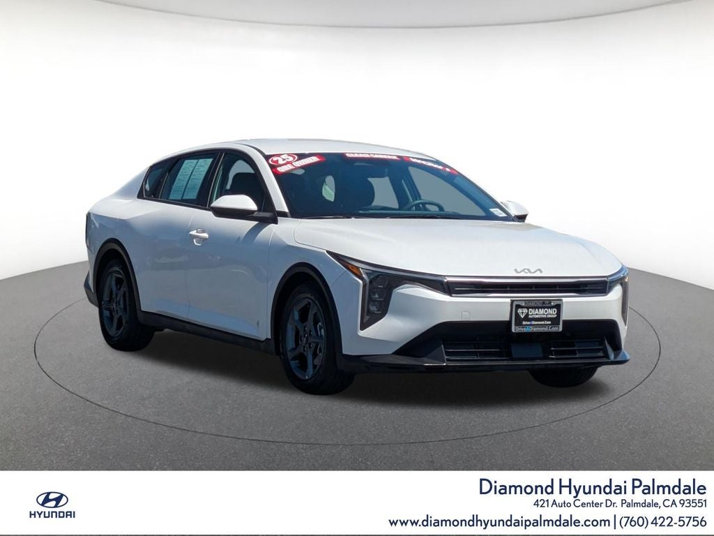 2025 Kia K4 LXS in Snow White Pearl — front three-quarter view