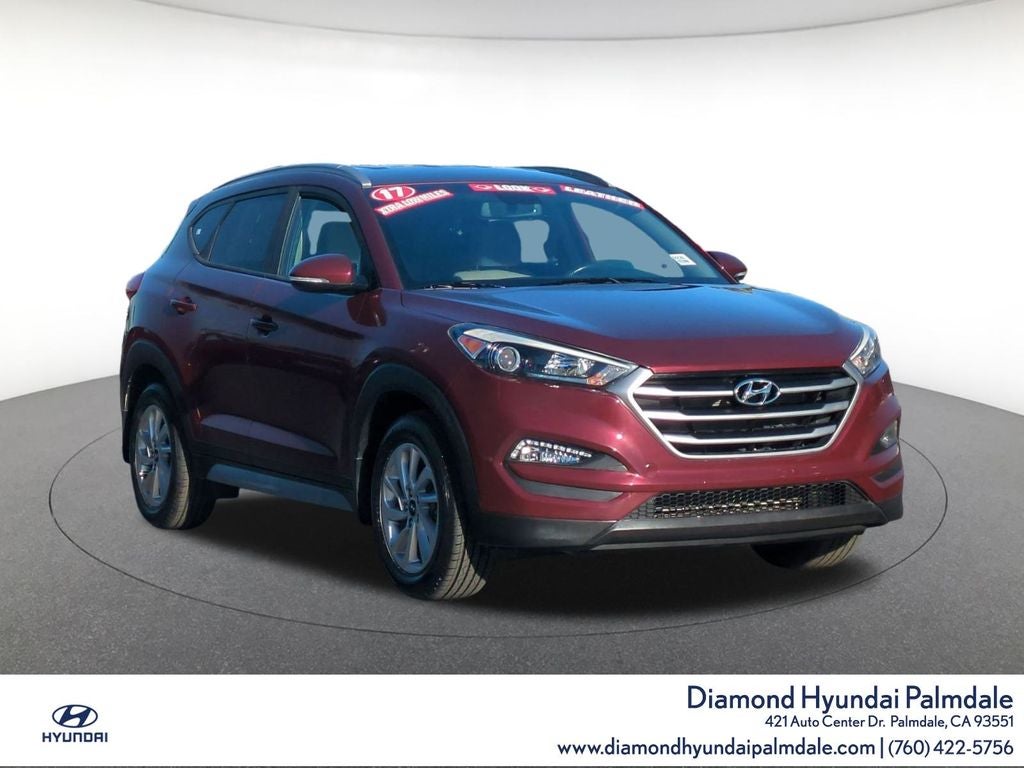 2017 Hyundai Tucson SE Plus in Ruby Wine — front three-quarter view