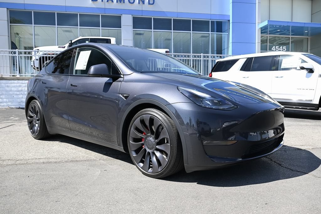 2024 Tesla Model Y Performance in Gray — front three-quarter view